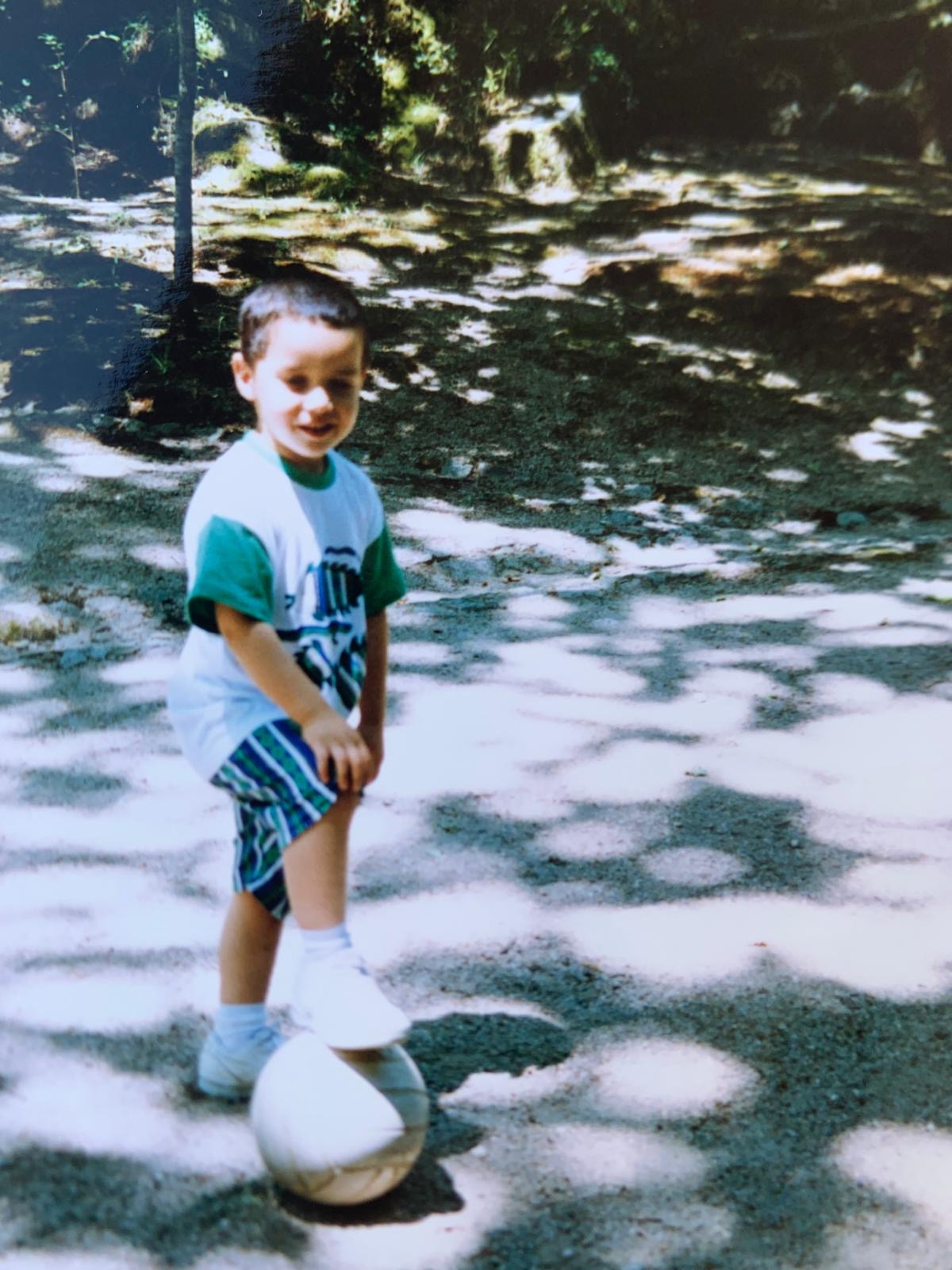 Carlos as a young boy with a football in Braga, Portugal